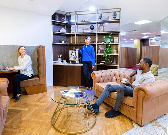 Client networking over a cup of coffee at Servcorp Mayfair's coworking space.